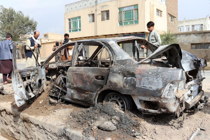 A destroyed vehicle, which contained rocket launchers, located where a rocket attack originated from in Kabul, Afghanistan, o