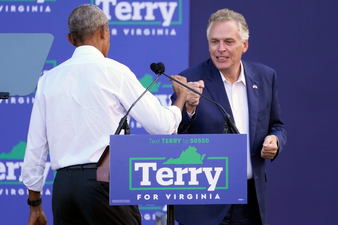 Former President Barack Obama gives a fist bump to Virginia Democratic gubernatorial candidate, former Gov. Terry McAuliffe, during a rally in Richmond, Va., Saturday, Oct. 23, 2021. 