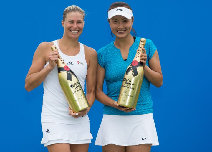 Andrea Hlavackova of the Czech Republic and Shuai Peng of China pose with the Doubles winners trophy at thhe WTA Aegon Open on June 12, 2016 in Nottingham, England.