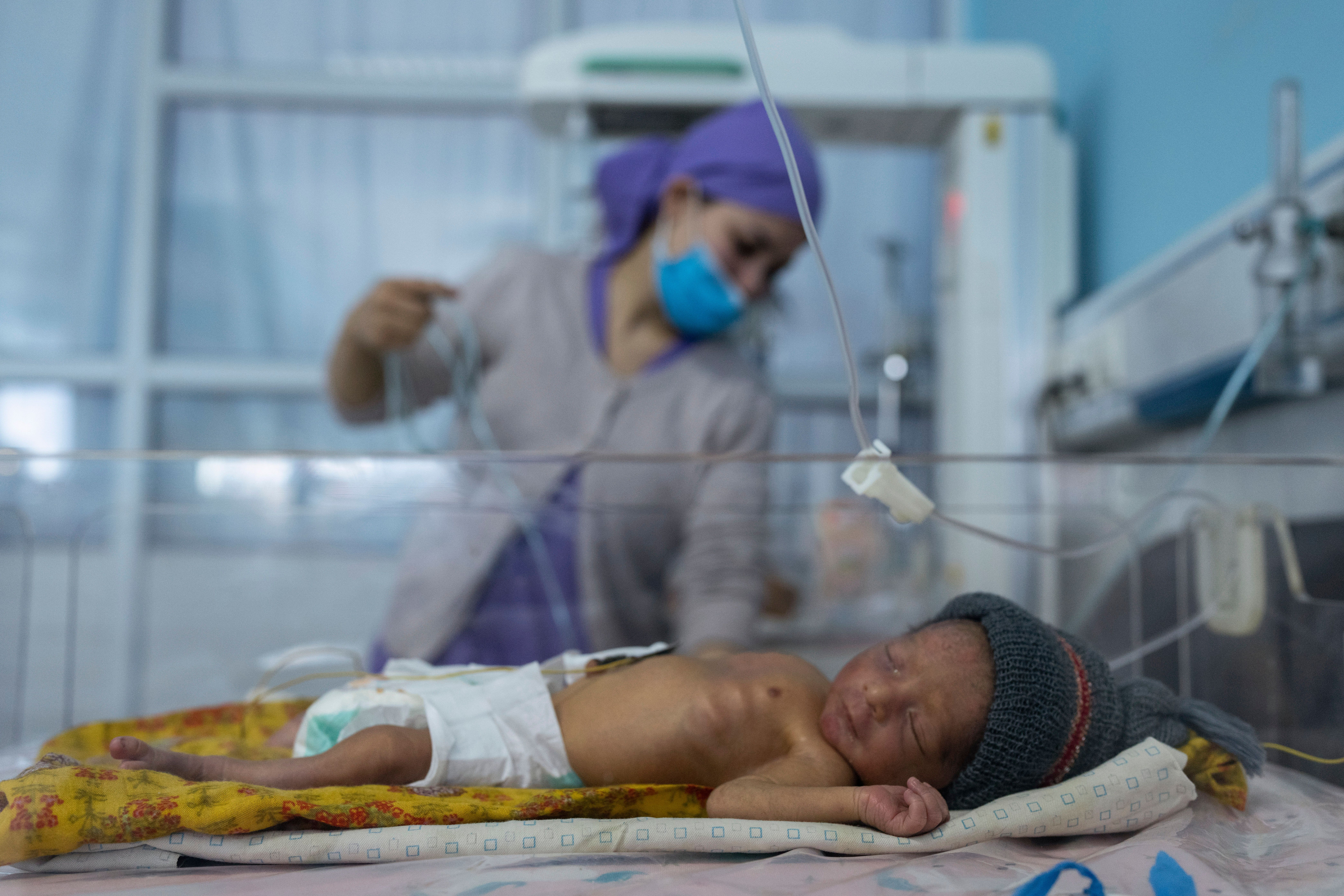 A nurse takes care of a baby in the neonatal intensive care unit of Malalai Maternity hospital in Kabul, Afghanistan. 