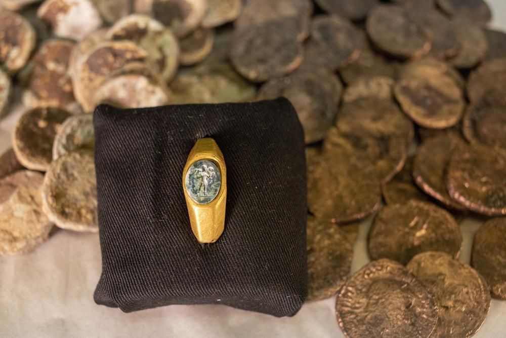 The remnants of a shipwreck include this Roman gold ring carved with the figure of a shepherd carrying a sheep on his shoulders.