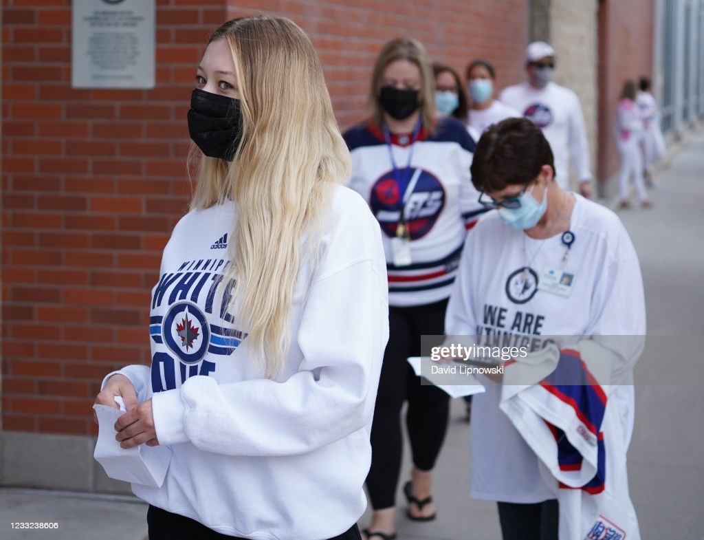 Fans arrive at the stadium to attend the Winnipeg Jets vs the Montreal Canadiens in Game One of the Second Round of the 2021 Stanley Cup Playoffs on...
