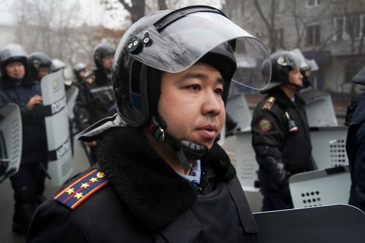 A riot police officer stands ready to stop demonstrators during a protest in Almaty, Kazakhstan, on Jan. 5, 2022. 