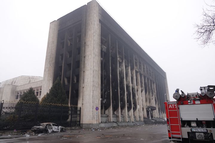 A picture taken on Jan. 7, 2022. shows a burnt-out administrative building in central Almaty, after violence that erupted following protests over hikes in fuel prices. 