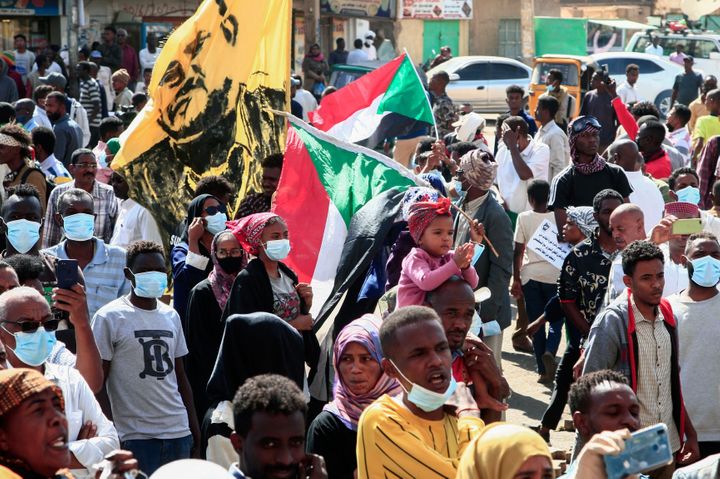 Sudanese demonstrators rally outside the presidential palace in Khartoum, demanding civilian rule.