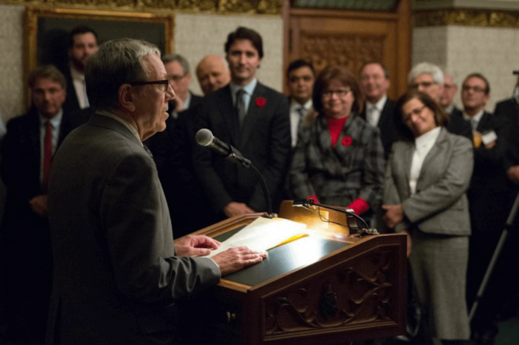 Irwin Cotler speaking at a Raoul Wallenberg Centre for Human Rights event with Justin Trudeau in the audience. (Photo: Raoul Wallenberg Centre for Human Rights)
