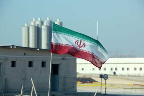 A picture taken on November 10, 2019, shows an Iranian flag in Iran's Bushehr nuclear power plant, during an official ceremony to kick-start works on a second reactor at the facility. - [ATTA KENARE/AFP via Getty Images]