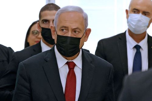 Former Israeli prime minister Benjamin Netanyahu leaves a Jerusalem court house on November 16, 2021. [JACK GUEZ/POOL/AFP via Getty Images]