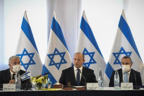 Israeli Prime Minister Naftali Bennett (C) and Israeli Foreign Minister Yair Lapid (L) attend Israeli government's weekly cabinet meeting in Golan Heights on December 26, 2021. [Israeli Government Press Of. (GPO) - Anadolu Agency]