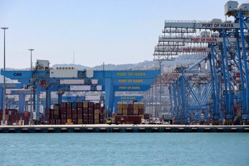 This picture shows countainer and cranes on the dock of Haifa port, on 24 June 2021 [EMMANUEL DUNAND/AFP/Getty Images]