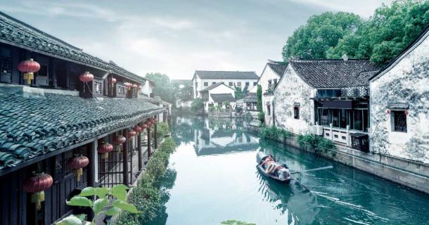 The waterway wonders of China’s Grand Canal are both picturesque and ancient in some sections but also super modern and unattractive in others. This part of the canal is in the ancient, preserved section of Shaoxing, Zhejiang, China. Source: gui yong nian / Adobe Stock