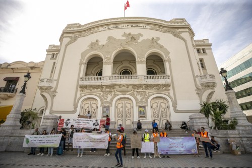 People, holding banners, gather to protest demanding a "state of emergency for the climate" in front of Municipal Theater in Tunis, Tunisia on September 25, 2022. [Yassine Gaidi - Anadolu Agency]