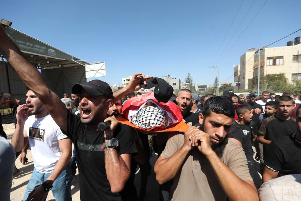 Mourners attend the funeral of four Palestinians who were killed by Israeli forces in the Jenin refugee camp on September 28, 2022. (Photo: Stringer/APA Images)