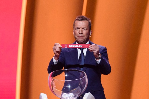 Former Football Player Lothar Matthaus shows Denmark during the FIFA World Cup Qatar 2022 Final Draw at Doha Exhibition Center on April 1, 2022 in Doha, Qatar. [Marcio Machado/Eurasia Sport Images/Getty Images]