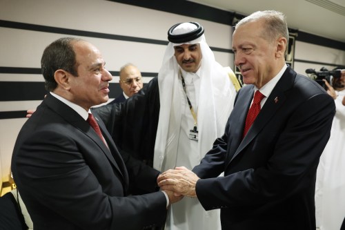 Turkish President Recep Tayyip Erdogan shakes hands with President of Egypt Abdel Fattah el-Sisi as they attend reception hosted by Qatari Emir Sheikh Tamim bin Hamad Al Thani on the occasion of the opening ceremony of the 2022 FIFA World Cup in Qatar on November 20, 2022. [ Murat Kula - Anadolu Agency]