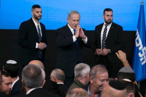 Former Israeli Prime Minister and Likud party leader Benjamin Netanyahu greets supporters at an election-night event on November 1, 2022 in Jerusalem, Israel [Amir Levy/Getty Images]