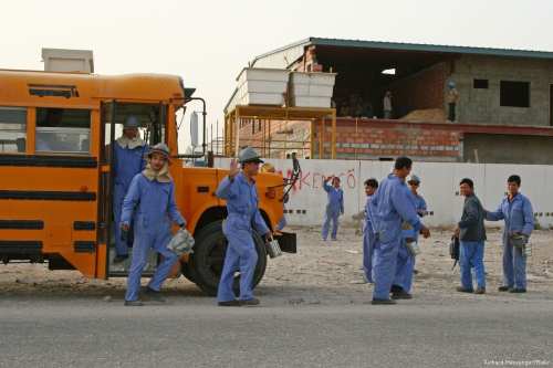 Construction workers in Doha, Qatar [Richard Messenger/Flickr]