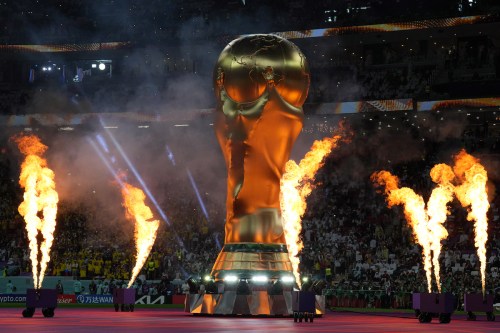 FIFA World Cup trophy replica displayed as fireworks set off on the pitch during the official opening ceremony of FIFA World Cup Qatar 2022 ahead of the opening match between Qatar and Ecuador at Al Bayt Stadium in Al Khor City, Qatar on November 20, 2022. [Salih Zeki Fazlıoğlu - Anadolu Agency]