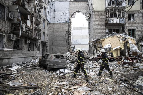 Firefighters conduct work in a destroyed building after Russian forces' missile attack hit an apartment, where 7 civilians lost their lives, in Mykolaiv, Ukraine on November 11, 2022. [Metin Aktaş - Anadolu Agency]