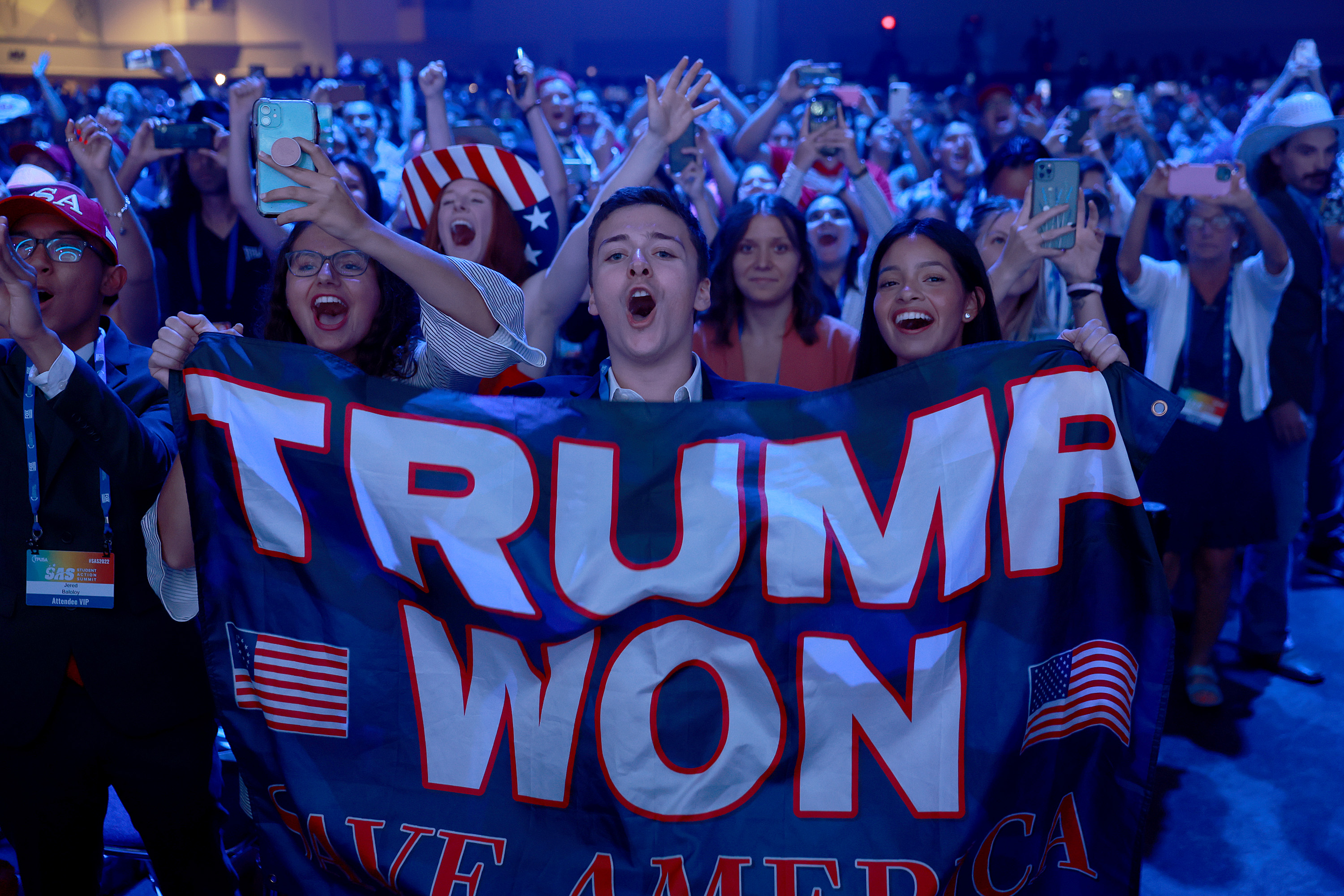 People cheer as former President Donald Trump arrives on stage during the Turning Point USA Student Action Summit held at the Tampa Convention Center on July 23, 2022 in Tampa, Fla.