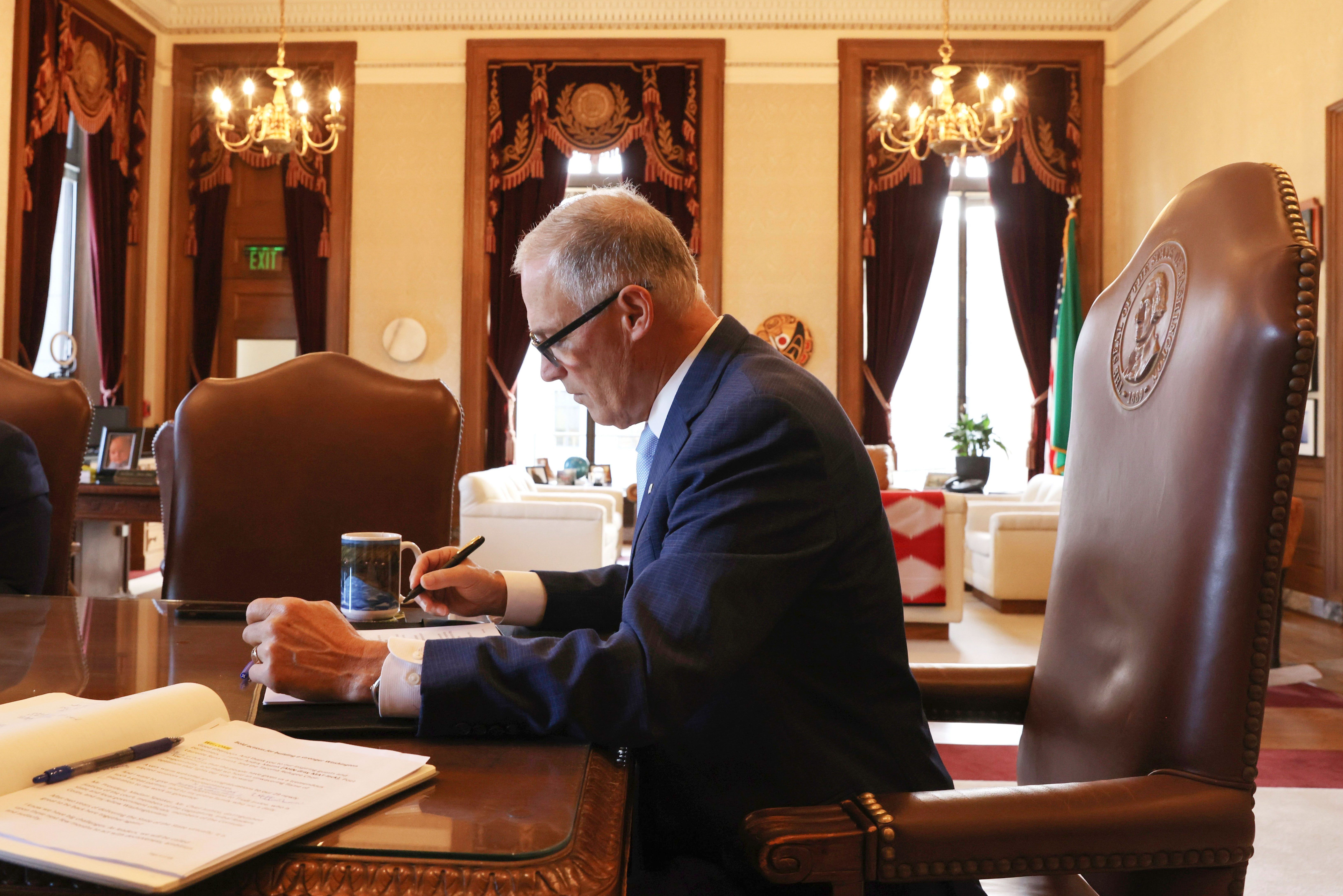 Washington Gov. Jay Inslee prepares his 2023 State of the State address at the Capitol in Olympia, Wash., on Jan. 10, 2023.