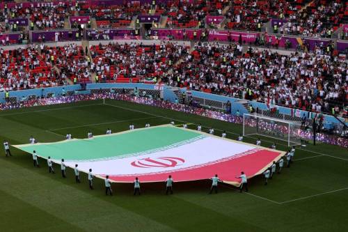 A giant flag of IR Iran on the pitch prior to the FIFA World Cup Qatar 2022 at Ahmad Bin Ali Stadium on November 25, 2022 in Doha, Qatar [Catherine Ivill/Getty Images]