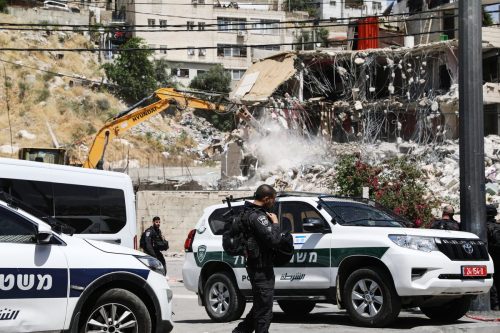 Israeli forces take security measure as Israeli excavators demolish 2-storey building in Silwan Neighbourhood of East Jerusalem, Jerusalem on May 10, 2022 [Mostafa Alkharouf/Anadolu Agency]