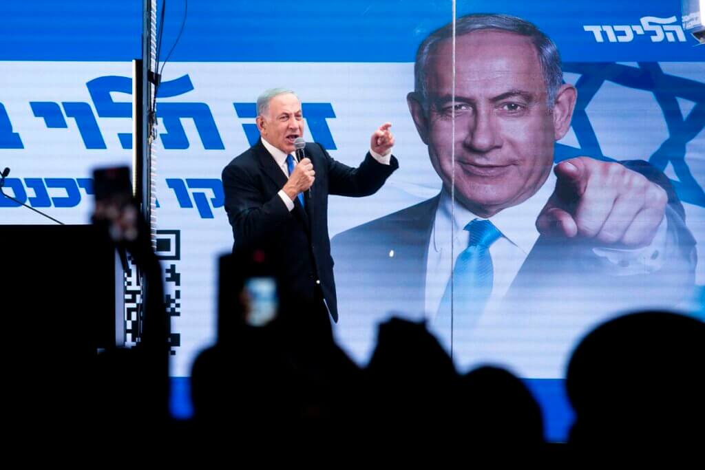 Benjamin Netanyahu speaks to supporters through inside a modified truck with a side bulletproof glass during a campaign event on October 29, 2022 in Bnei Brak. (Photo: Amir Levy/Getty Images)