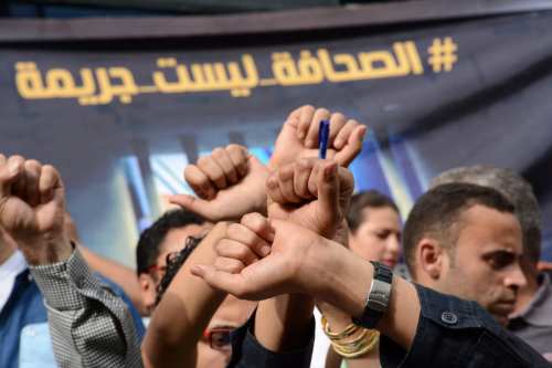 Egyptian Journalists take part during a protest against the arrests of fellow journalists outside the Egyptian Journalist syndicate headquarters in the capital Cairo on 3 May 2016 on the occasion of World Press Freedom day. [Amr Sayed/Apaimages]