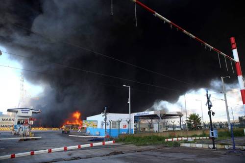 Fire in the containers that overturned after the earthquake in the Iskenderun Port continues in Hatay, after 7.7 and 7.6 magnitude earthquakes hit Kahramanmaras, Turkiye on February 7, 2023 [Sezgin Pancar/Anadolu Agency]
