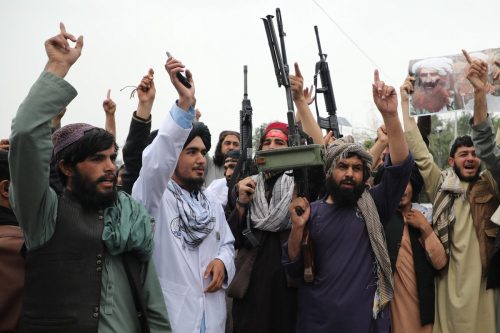 Taliban members stage a demonstration to celebrate Taliban's first anniversary of taking over the government, in the capital Kabul, Afghanistan on August 15, 2022 [Haroon Sabawoon/Anadolu Agency]