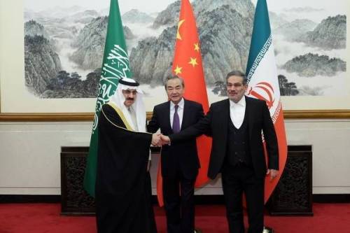 Iran's top security official Ali Shamkhani (R), Chinese Foreign Minister Wang Yi (C) and Musaid Al Aiban, the Saudi Arabia's national security adviser pose for a photo after Iran and Saudi Arabia have agreed to resume bilateral diplomatic ties after several days of deliberations between top security officials of the two countries in Beijing, China on March 10, 2023 [CHINESE FOREIGN MINISTRY/Anadolu Agency]