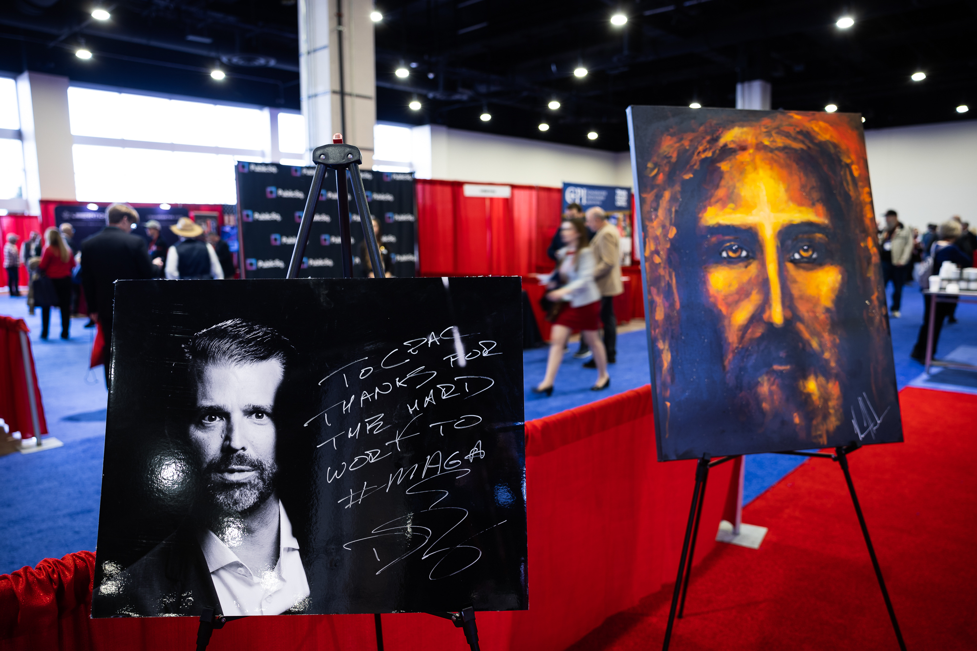 A signed photograph of Donald Trump, Jr. and a painting of Jesus Christ stood side-by-side in one of the halls.