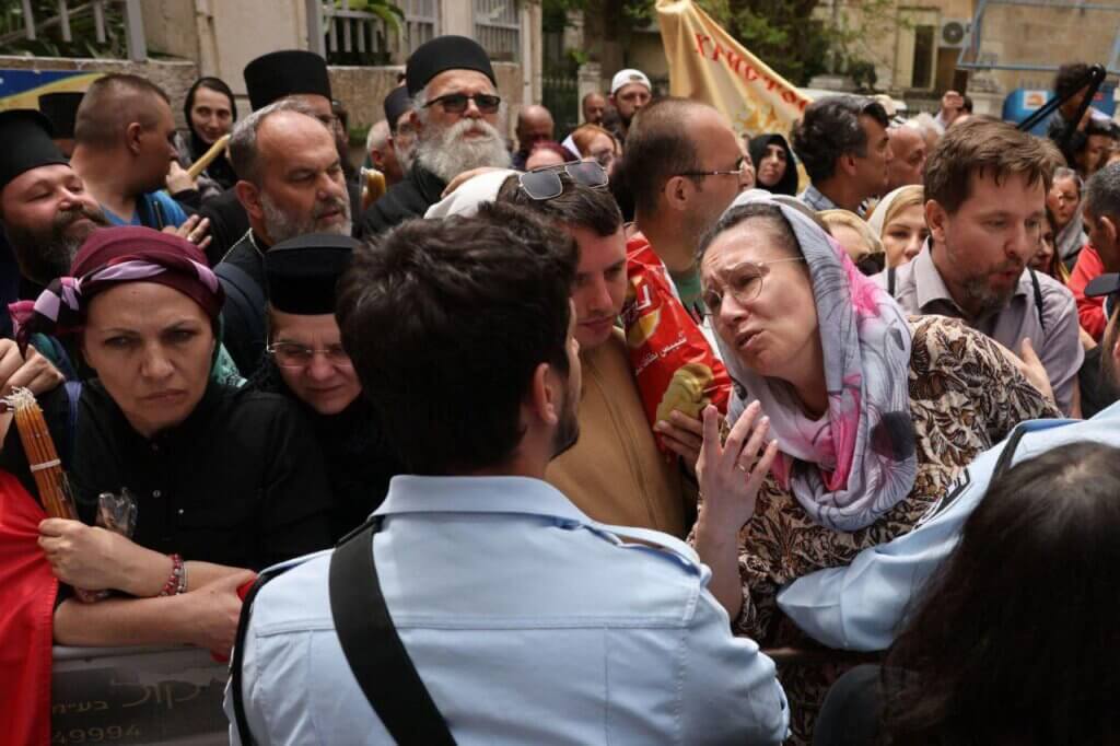 Israeli military forces assault Palestinian Christians, denying them access to Church of the Holy Sepulchre to celebrate Holy Saturday in the occupied Jerusalem’ Old City. (Photo via Social Media/Al Qastal News)