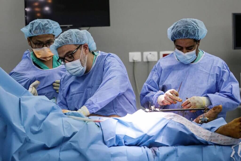 Dr. Ghassan Abu-Sittah, center, performing emergency reconstructive surgery in Gaza during the 11-day war in May 2021.